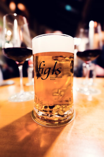 Glass of lager beer served at Figls restaurant in Vienna.
