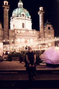 Adriana in front of St. Charles Church (Karlskirche) during the Christmas market season.