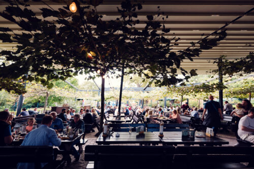 Spacious outdoor terrace at Luftburg Kolarik, perfect for enjoying a sunny day in Vienna's Prater.