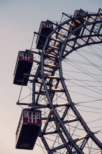 Spring sunshine highlighting the red cabins of the Giant Ferris wheel (Wiener Riesenrad).