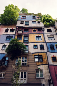 Intricate mosaic patterns covering Hundertwasserhaus walls, each piece telling part of Vienna's most colorful architectural story.