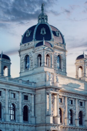The Kunsthistorisches Museum Vienna features magnificent Neo-Renaissance architecture with rich decorations, imposing columns, and a large dome.