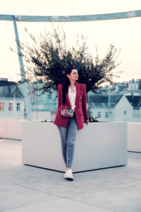 ashion portrait of Adriana posing at MQ Libelle with architectural elements and natural lighting.