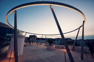 Industrial design elements at MQ Libelle Vienna with exposed structural components and contemporary urban architecture.