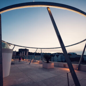 Industrial design elements at MQ Libelle Vienna with exposed structural components and contemporary urban architecture.