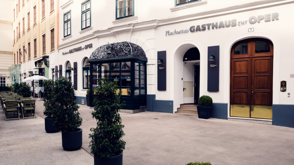 Morning light at Plachutta's iconic entrance, where historic architecture frames Vienna's famous culinary destination.
