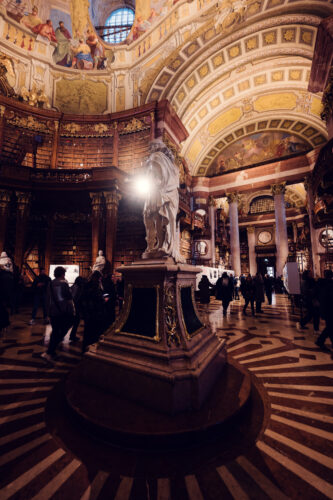 Dramatic play of light and shadow in the Prunksaal.