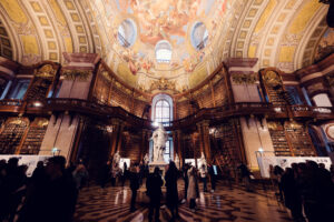 Prunksaal's central dome, framed by towering bookcases.