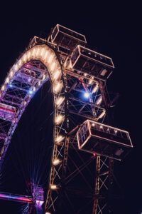 Vienna Giant Ferris Wheel (Wiener Riesenrad) illuminated against the night sky, its lights creating a magical display in Prater.