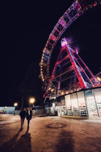 Dramatic night shot of the Giant Ferris Wheel (Wiener Riesenrad) with its vintage cabins.