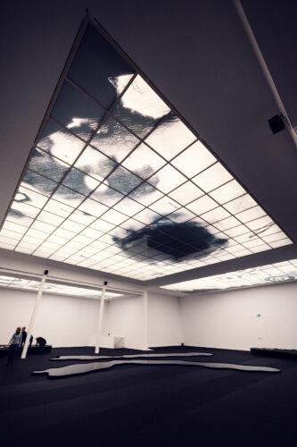 Interior exhibition space of the Vienna Secession Building with its minimalist white walls and natural lighting.