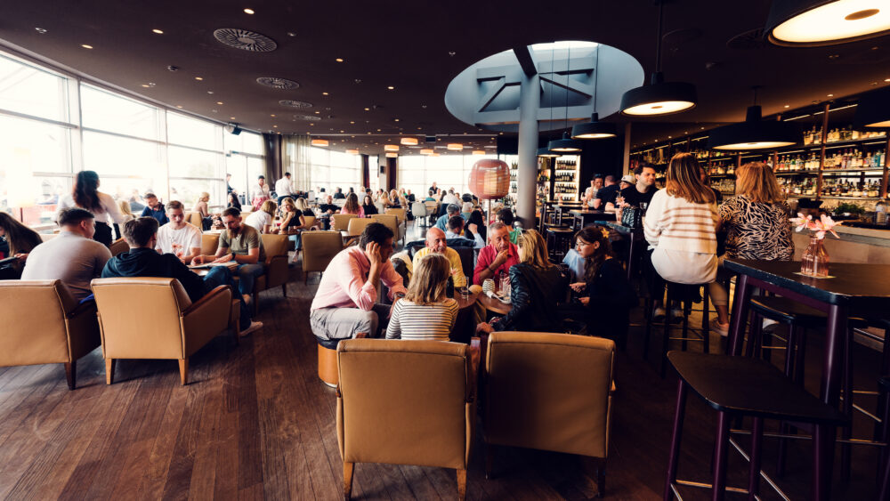 Cozy seating area in the interior of Sky Bar & Roofgarden at Steffl, perfect for enjoying a drink.