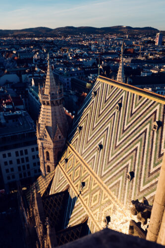 St. Stephen's Cathedral Gothic spires silhouetted against sunset sky.