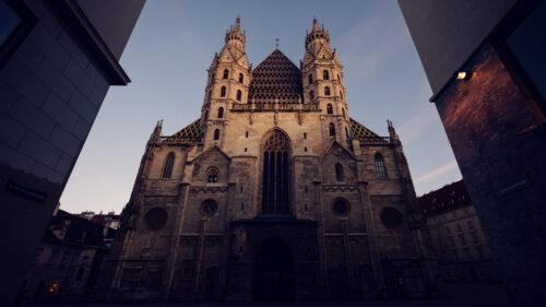 Morning light illuminating the St. Stephen's Cathedral intricate stone facade, perfect for architectural photography.