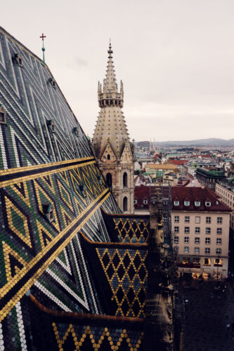 St. Stephen's Cathedral tiled roof against Vienna's skyline.