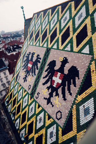 Close-up detail of St. Stephen's Cathedral's ornate roof mosaic.