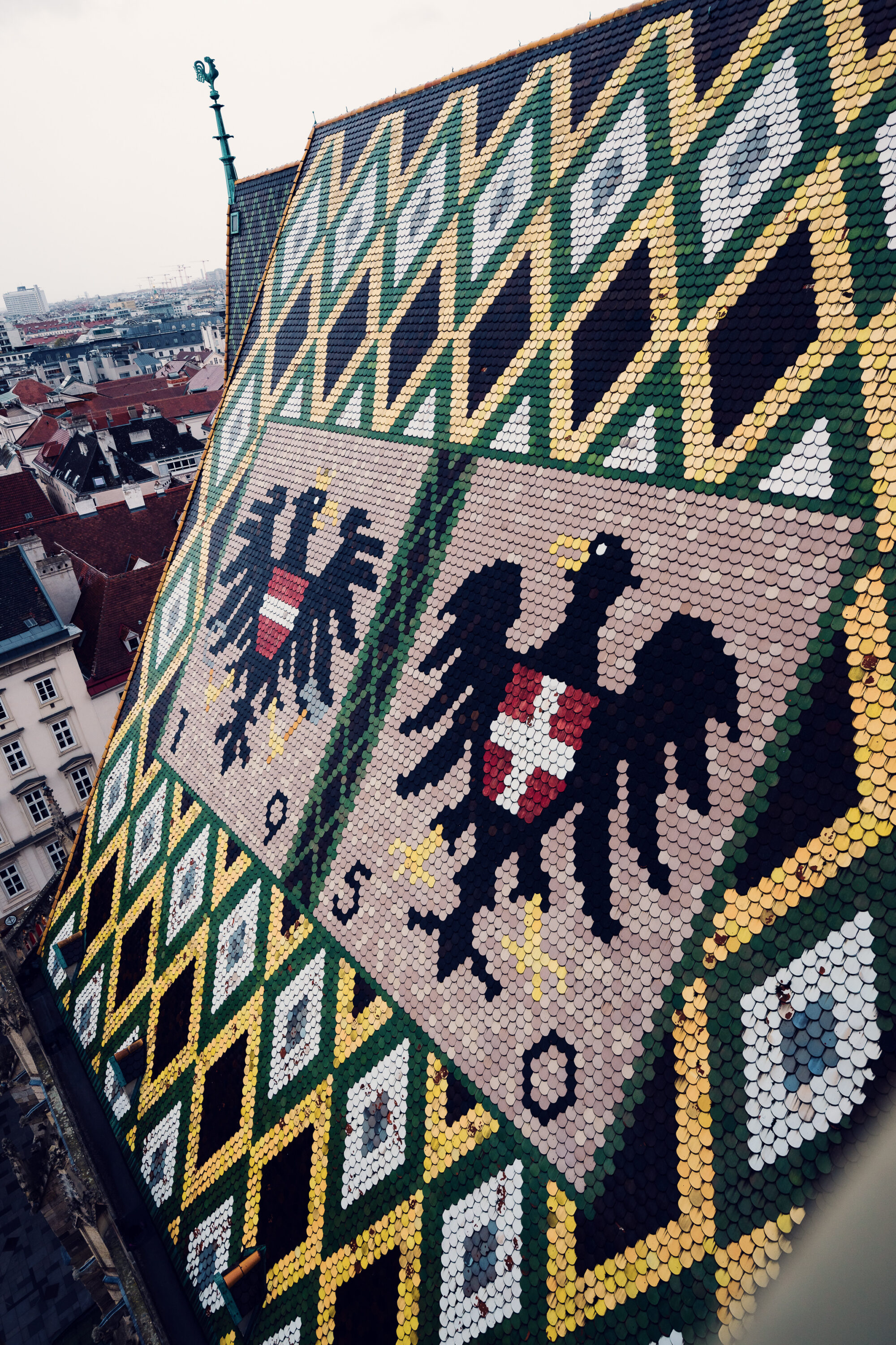 Close-up detail of St. Stephen's Cathedral's ornate roof mosaic.
