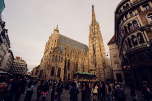 St. Stephen's Cathedral silhouette at sunset against Vienna's skyline.