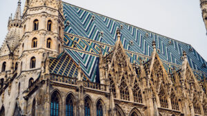 The mosaic roof of St. Stephen's Cathedral in morning light, a pattern of 230,000 glazed tiles.