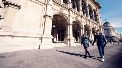 Adriana and Mario strolling in front of the Vienna State Opera.
