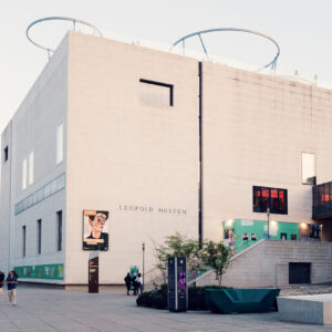 Exterior of Leopold Museum Vienna with its distinctive white limestone cube design in the MuseumsQuartier cultural complex, showcasing modern architectural minimalism.