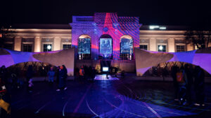 Festive winter illumination at MuseumsQuartier Vienna transforming cultural complex into magical evening scene.
