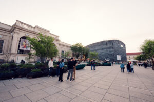 Architectural dialogue between baroque and modern elements in MuseumsQuartier's design.