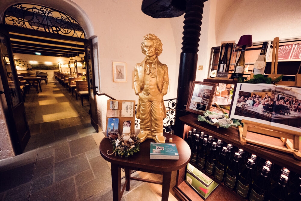 Heuriger Mayer am Pfarrplatz shop, offering a selection of local wines and artisanal products.