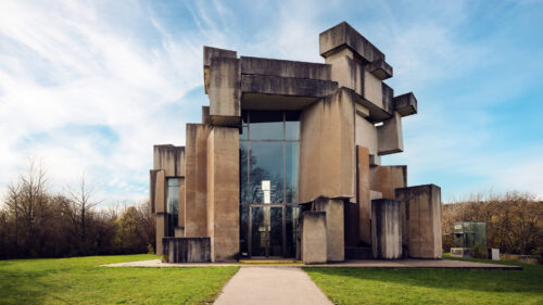 Wotrubakirche surrounded by Vienna's greenery, a contrast between nature and modern design.