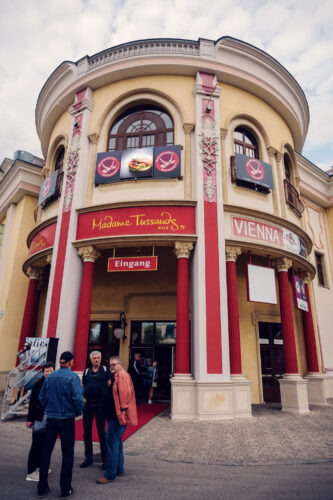 Madame Tussauds wax museum building at Prater Vienna Austria, famous celebrity figure attraction with distinctive museum architecture in traditional Wiener Prater amusement park.