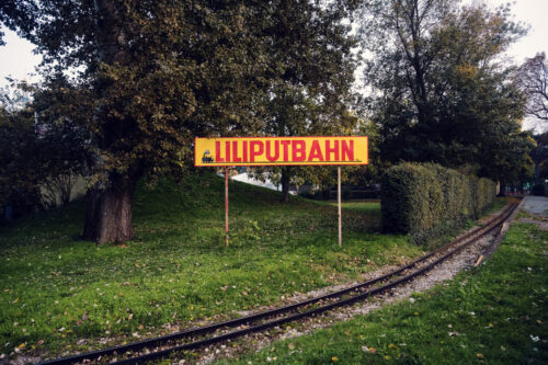 Liliputbahn narrow-gauge railway Prater Vienna Austria, traditional miniature train attraction with passenger cars and scenic route through Wiener Prater park.