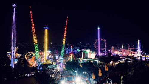 Prater Vienna at night, illuminated amusement park with glowing rides and festive lighting in historic Wiener Prater district.