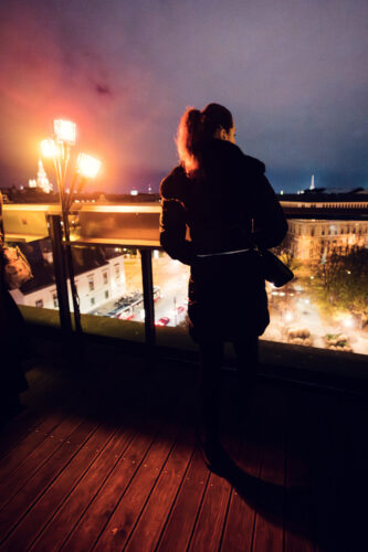 Enjoying the breathtaking cityscape from the terrace at Der Dachboden, a perfect spot to take in Vienna's skyline.