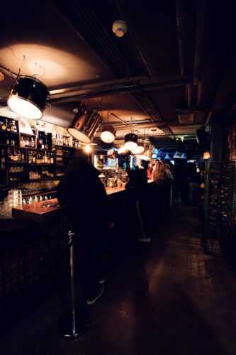Vibrant atmosphere at Der Dachboden rooftop bar, offering panoramic views of Vienna.