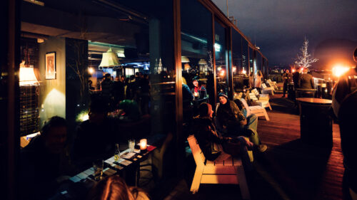 Ample outdoor seating at Der Dachboden, offering a perfect spot to relax and enjoy the Vienna skyline.