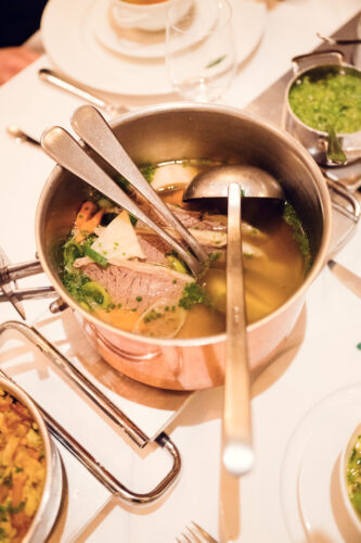 Clear beef broth with bone marrow and herb garnish at Plachutta Stammhaus Hietzing.