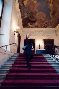 Adriana posing on baroque staircase at Schönbrunn Palace (Schloss Schönbrunn).