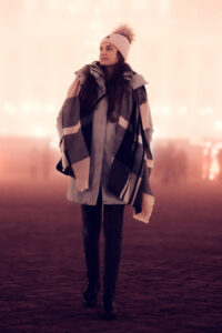 Adriana at Schönbrunn Palace (Schloss Schönbrunn) Christmas Market, traditional Austrian Christkindlmarkt with illuminated wooden stalls and holiday atmosphere.