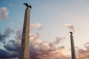 Historic palace gate with two imperial eagle sculptures at Schönbrunn Palace.