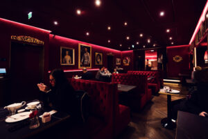 Elegant interior of Café Sacher Bel Étage, blending traditional charm with modern comfort.