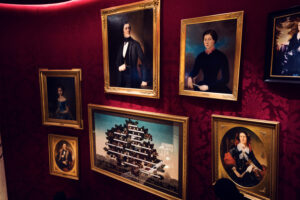 Artistic pictures adorning the walls of Café Sacher Bel Étage, reflecting Vienna's rich culture.