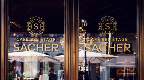 Entrance door to Café Sacher Bel Étage, inviting guests to indulge in a Viennese classic.