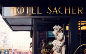 Elegant entrance door to Hotel Sacher, offering a warm welcome to visitors.
