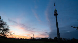 Donauturm tower framed by trees in Donaupark.