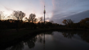 Donauturm rising above the treetops of Donaupark.