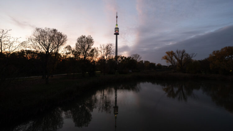 Donauturm rising above the treetops of Donaupark.