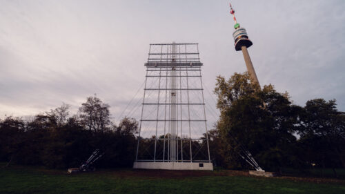 Wide-open Papstwiese meadow in Donaupark on a sunny day.