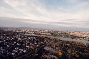 Donauturm Vienna observation deck sunset over Danube River.