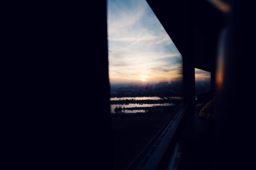 Donauturm Vienna sunset colors pink orange sky over Vienna.