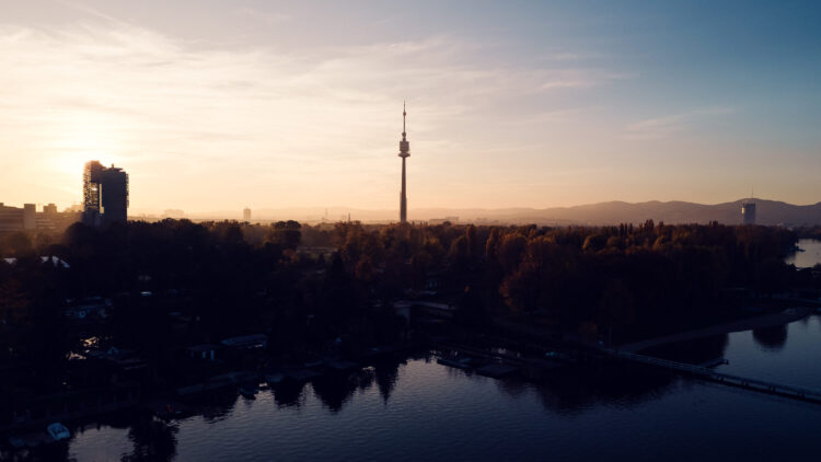 Danube Tower (Donauturm) in Vienna, standing 252 meters tall with its observation deck and revolving restaurant above the Danube River.